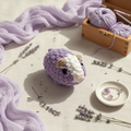 Lavender plushie styled flat lay with calming elements